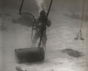 Navy Diver salvages unexploded munitions. 